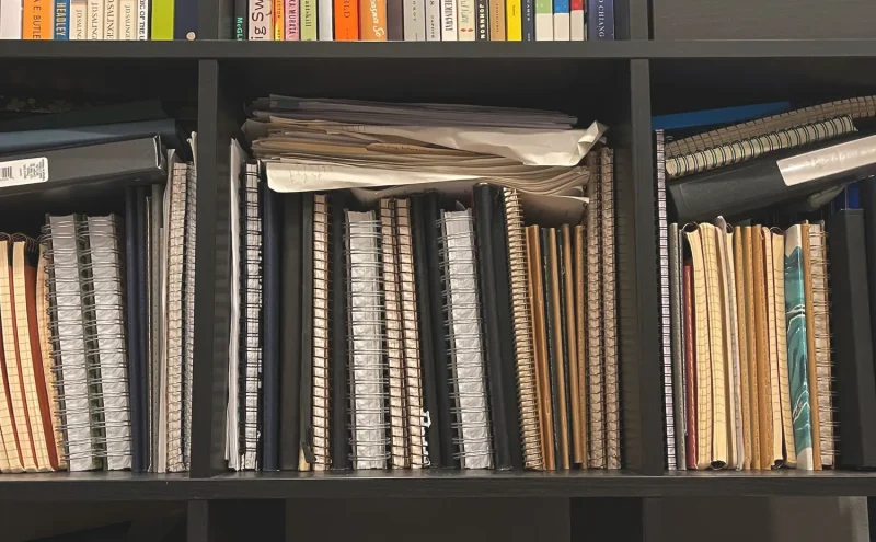 Shelf of notebooks.
